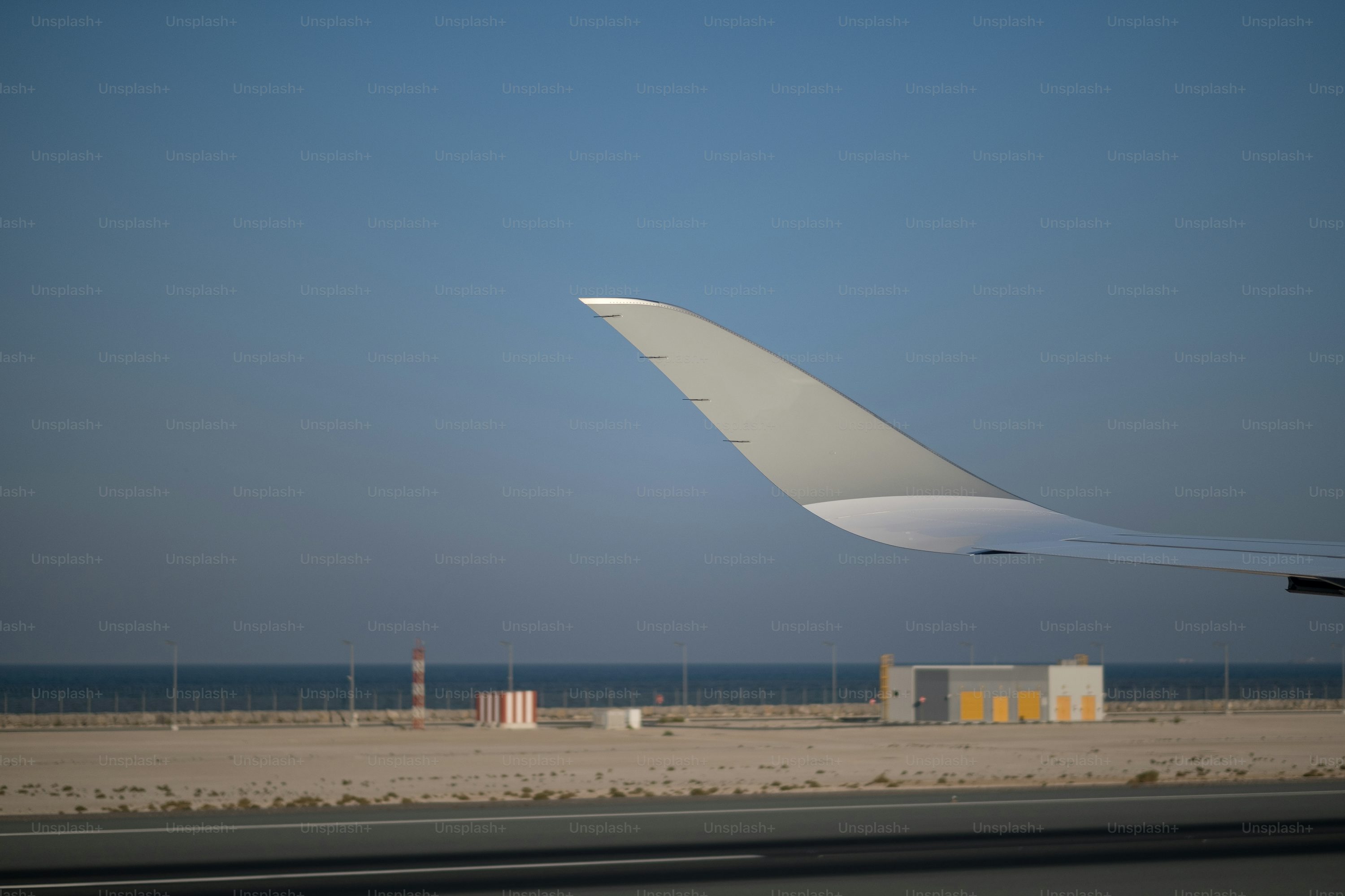 Aircraft wing viewed from an airport window